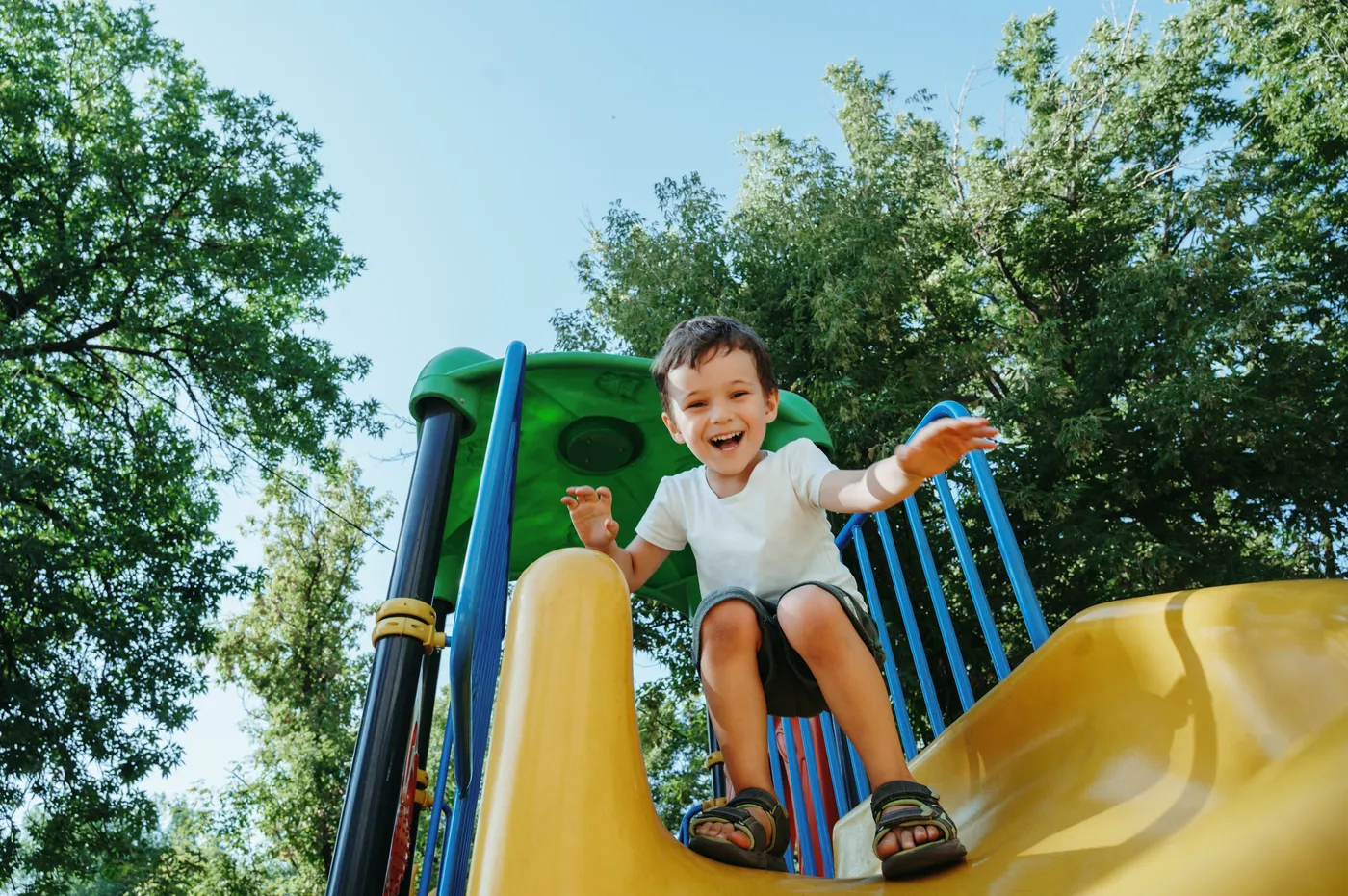 Child playing on a playground slide