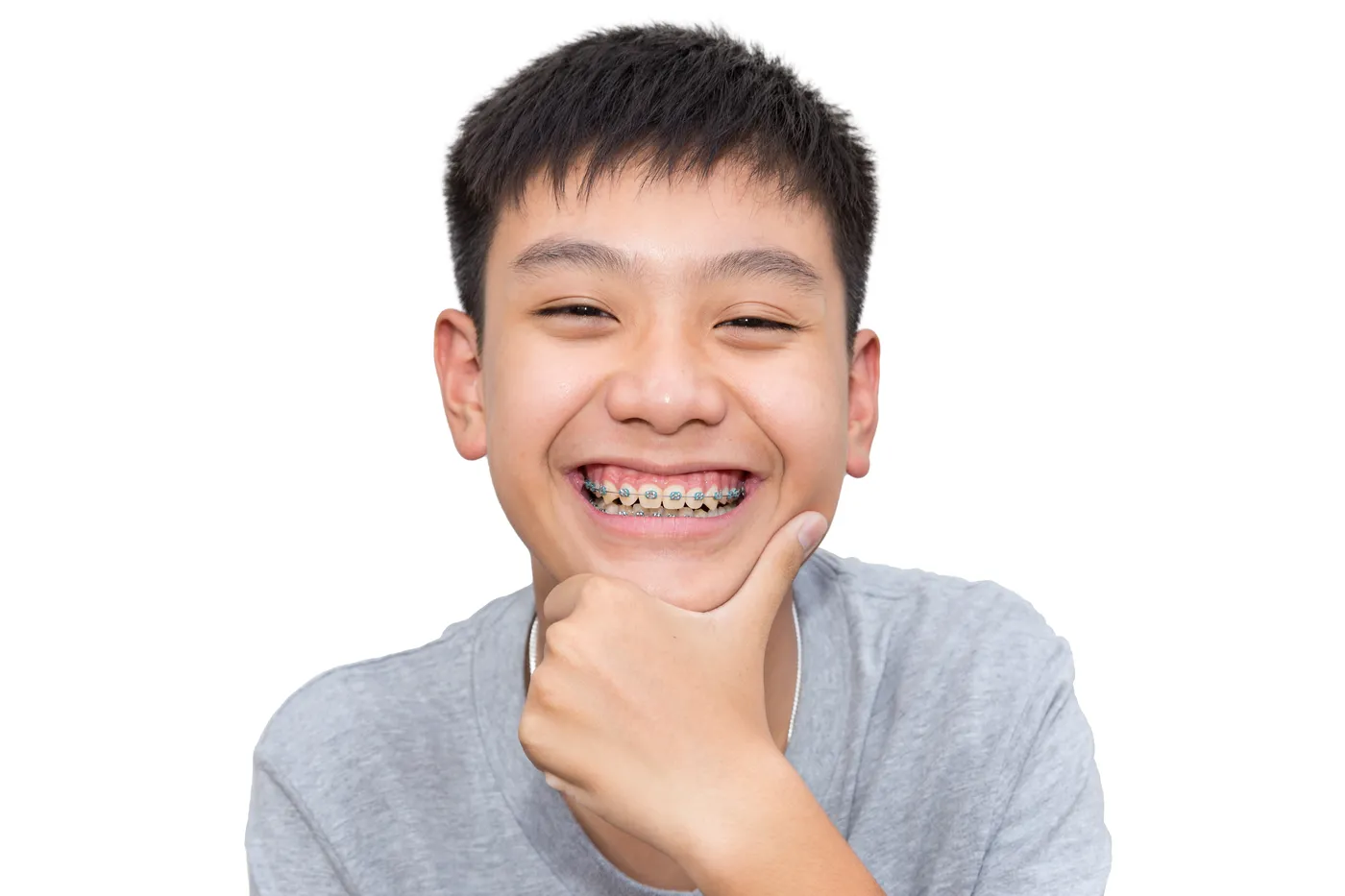 Happy boy with braces giving a thumbs up