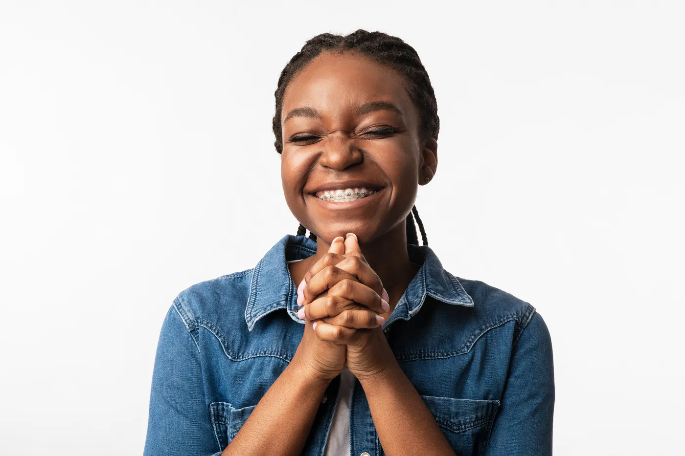 Smiling teen girl wearing traditional metal braces