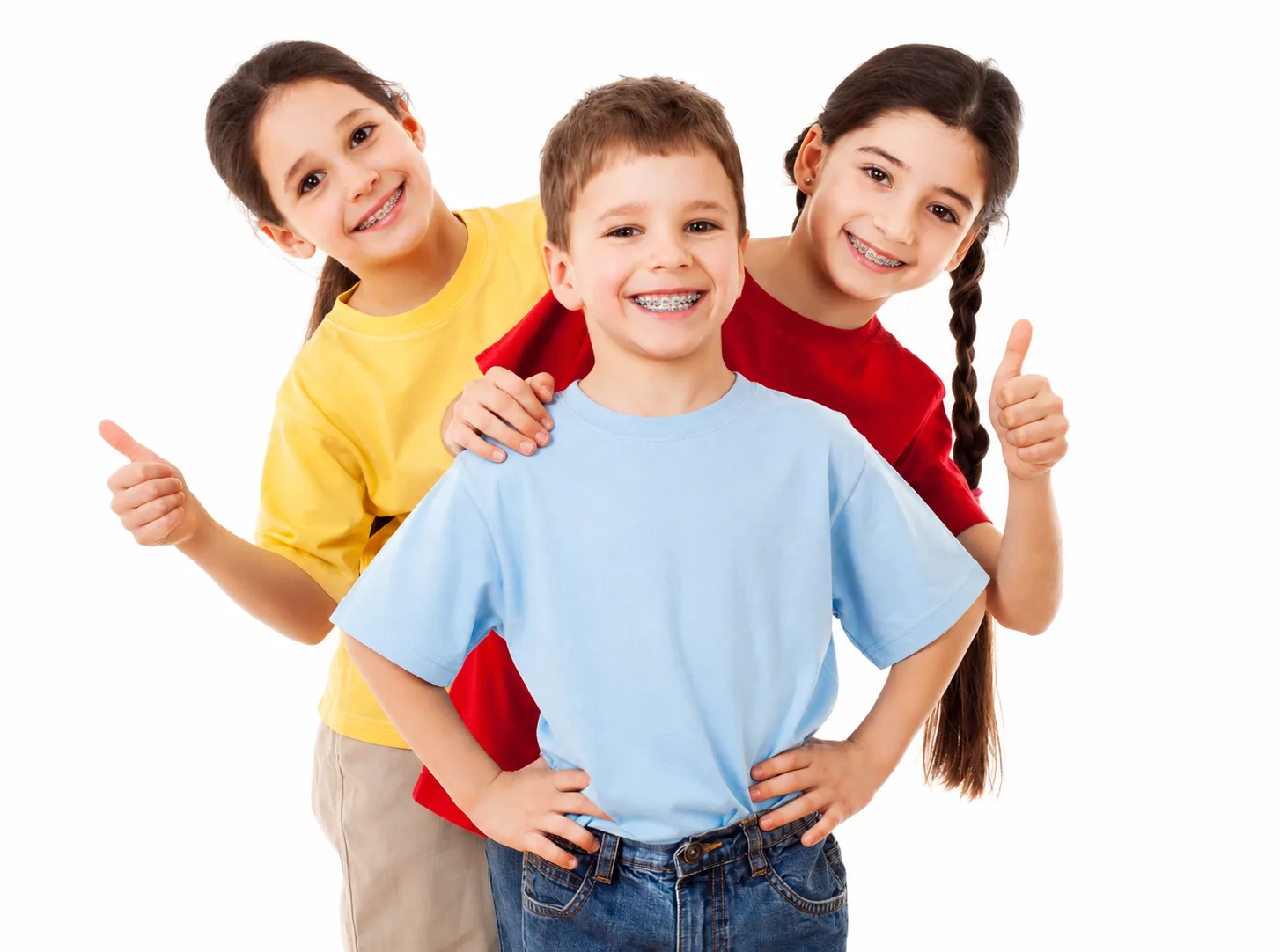 Three smiling kids giving a thumbs up, one wearing braces