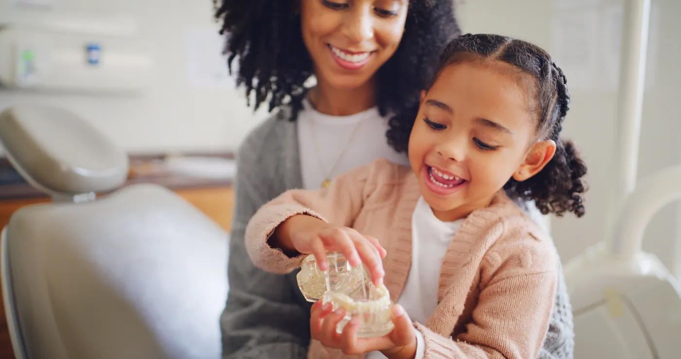 Parent helping child prepare for dental visit